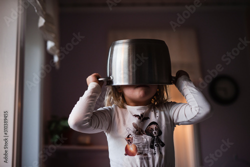 Girl wearing pot on head