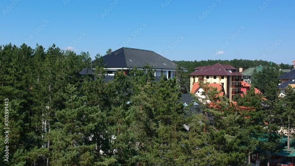 Zlatibor, Serbia aerial view rising above woodlands to scenic apartment views across the pristine outdoors Zlatibor, Serbia aerial view rising above woodlands to scenic apartment views across the pristine outdoors