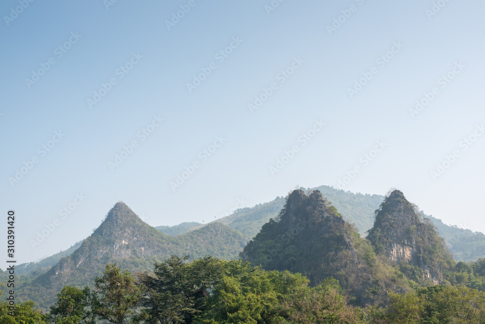 Karst formation and foggy limestone mountain landscape between Guiling and Yangshuo, Guangxi province, China