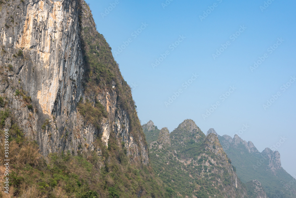 Karst formation and foggy limestone mountain landscape between Guiling and Yangshuo, Guangxi province, China
