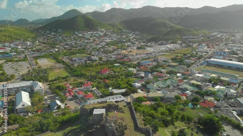 Revealing aerial of Marigot, Saint Martin with an ancient eighteenth centruy fort in the foreground photo