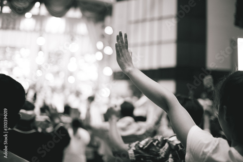 soft focus of Christian worship with raised hand,music concert