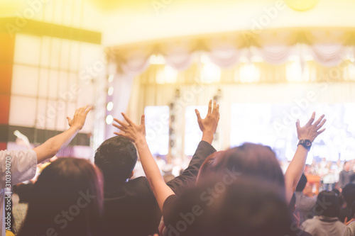 soft focus of Christian worship with raised hand,music concert