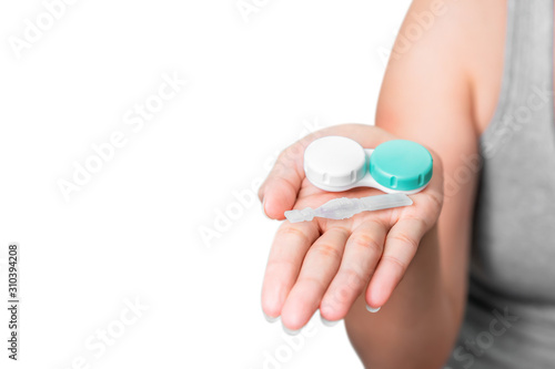 Asian woman holding contact lens on white background, Selective focus on contact lens , myopia and eyesight problem concept.