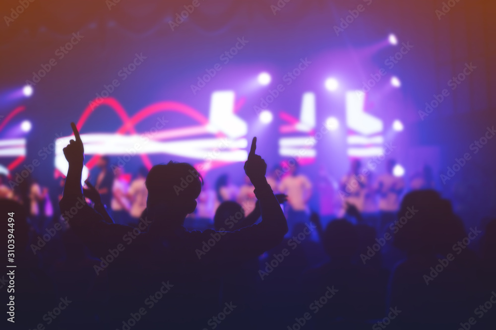 soft focus of Christian worship with raised hand,music concert