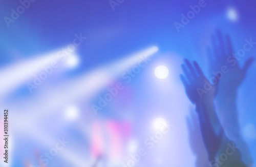 soft focus of Christian worship with raised hand,music concert
