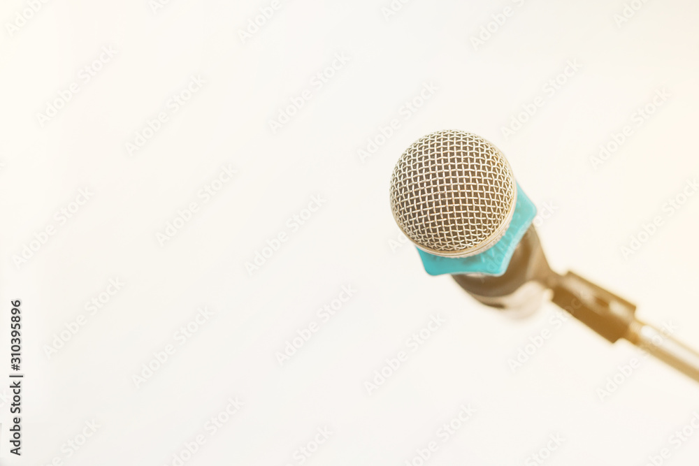 Microphone on abstract blurred at the speech podium Microphone on abstract blurred at the speech podium