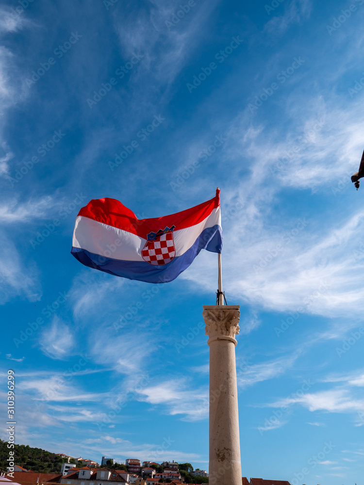 Croatian flag flying in coastal town of Trogir, Croatia