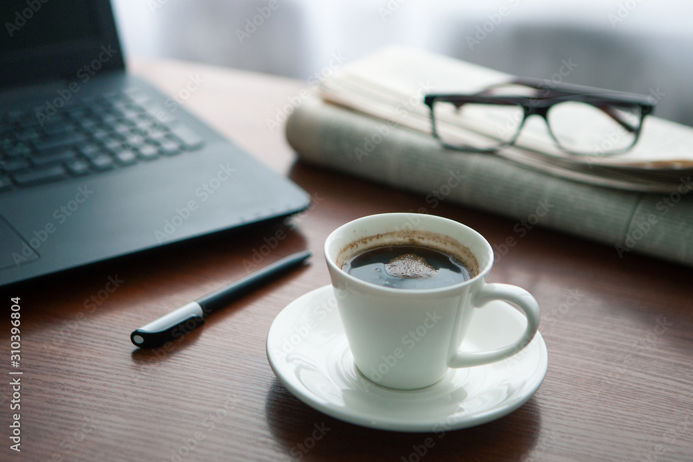 Newspaper with computer on table. Coffee break. Newspaper with computer on table. Coffee break.
