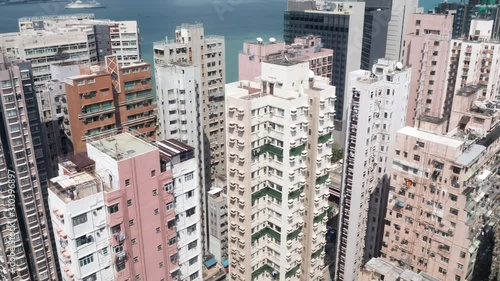 A motion time-lapse shot of Hong Kong apartment buildings area with day to night transition