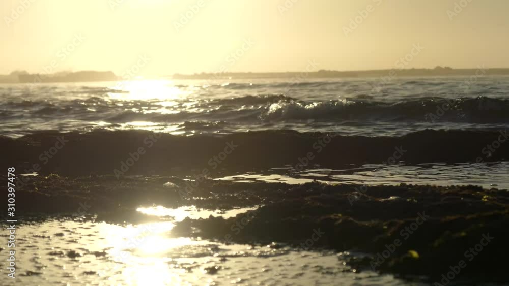 Moroccan beach at sunset with a low tide Moroccan beach at sunset with a low tide