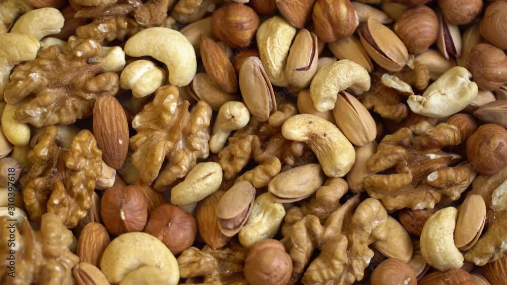 Collage of kernels of nuts. Macro. Clockwise rotation. 4K. Collage of kernels of nuts. Macro. Clockwise rotation. 4K.