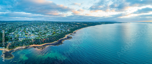 Wide aerial panorama of Mount Eliza suburb and coastline at sunset. Melbourne, Australia