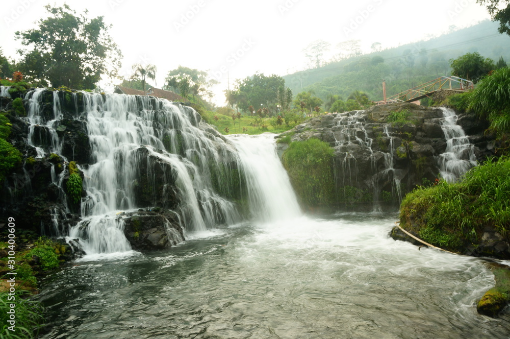 Fototapeta premium Belawan waterfall is located in the Ijen mountain region and is one of the tourist destinations in Bondowoso district, the water is clear and fresh and the air is cool so that the tour can be relaxed