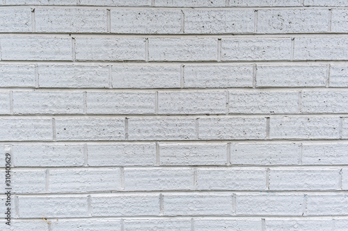 Slim modern brick wall painted in white background texture