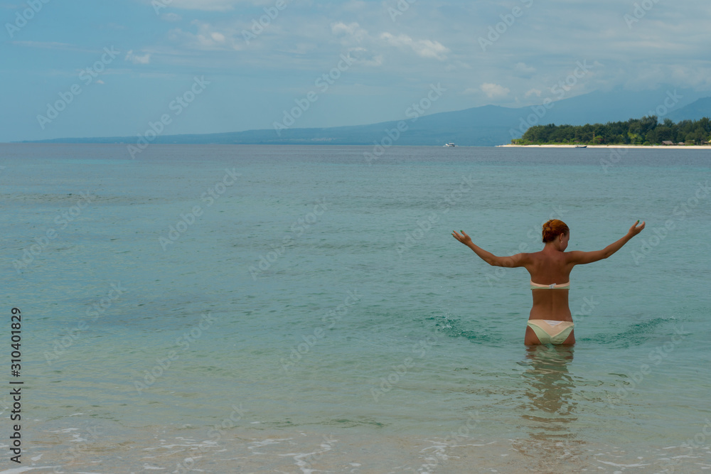 Woman at tropical island beach Woman at tropical island beach