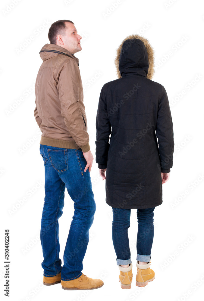 Back view of couple in winter jacket. Back view of couple in winter jacket.
