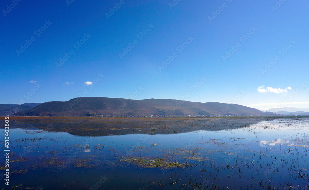 Fototapeta premium Yila Grassland of Napa Lake (Na Pa Hai), Yunnan, China.
