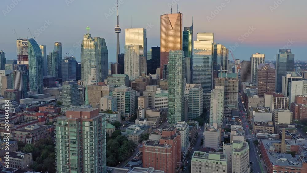 Aerial: Establishing shot of apartments & downtown Toronto city skyline at sunrise. Ontario, Canada. Aerial: Establishing shot of apartments & downtown Toronto city skyline at sunrise. Ontario, Canada.