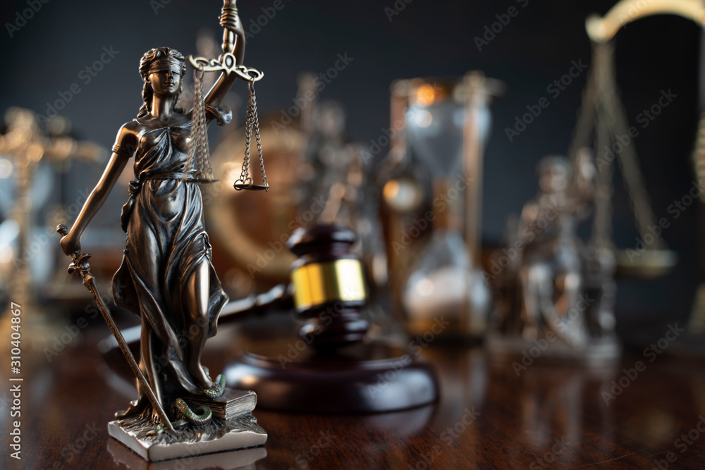 Law theme. Gavel of the judge, Themis statue and scale of justice on gray background. Law theme. Gavel of the judge, Themis statue and scale of justice on gray background.