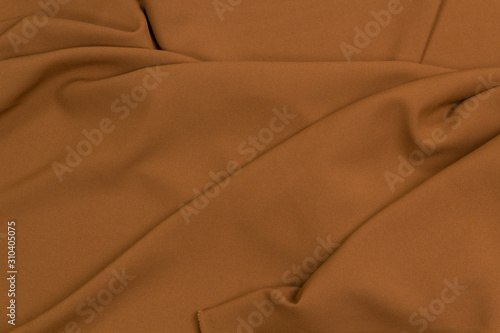 Fabric costume gabardine.  Brown textiles background in your layout photo