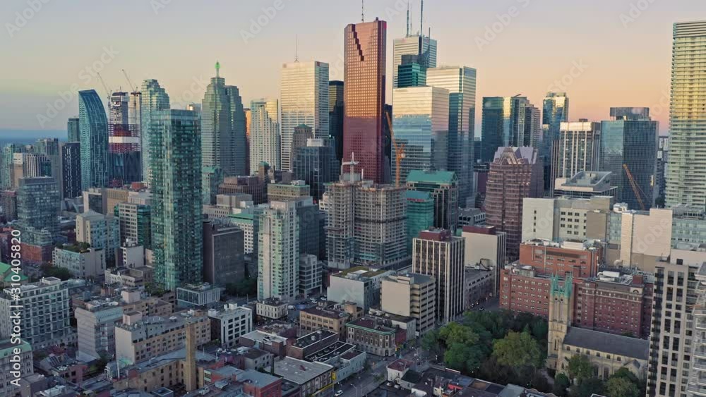 Aerial: Establishing shot of apartments & downtown Toronto city skyline at sunrise. Ontario, Canada. Aerial: Establishing shot of apartments & downtown Toronto city skyline at sunrise. Ontario, Canada.