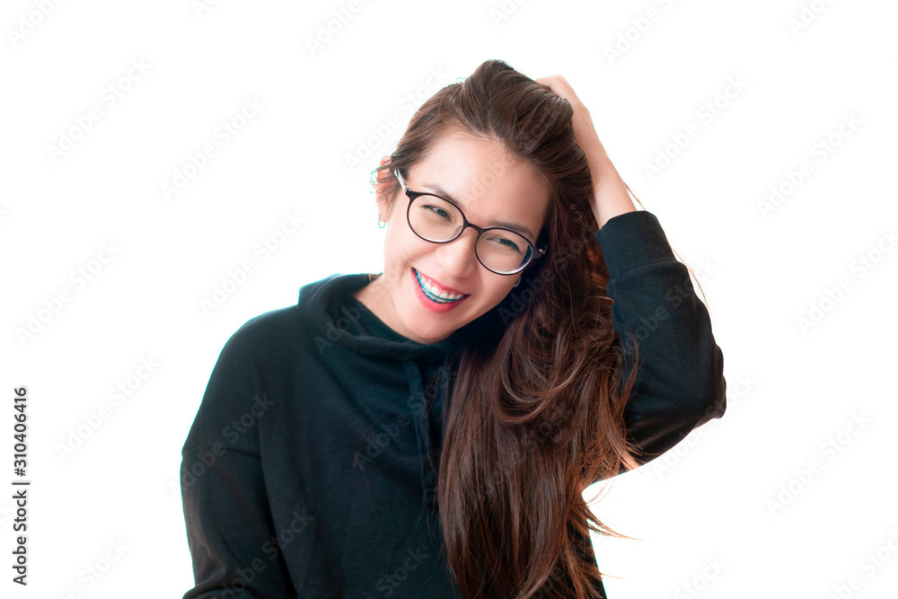 Obraz premium Smiling asian woman standing and touch her hair looking at camera isolate on white background.
