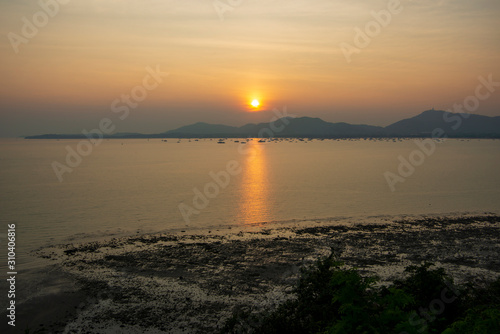 The sun sets on beautiful beach in Thailand, Phuket.