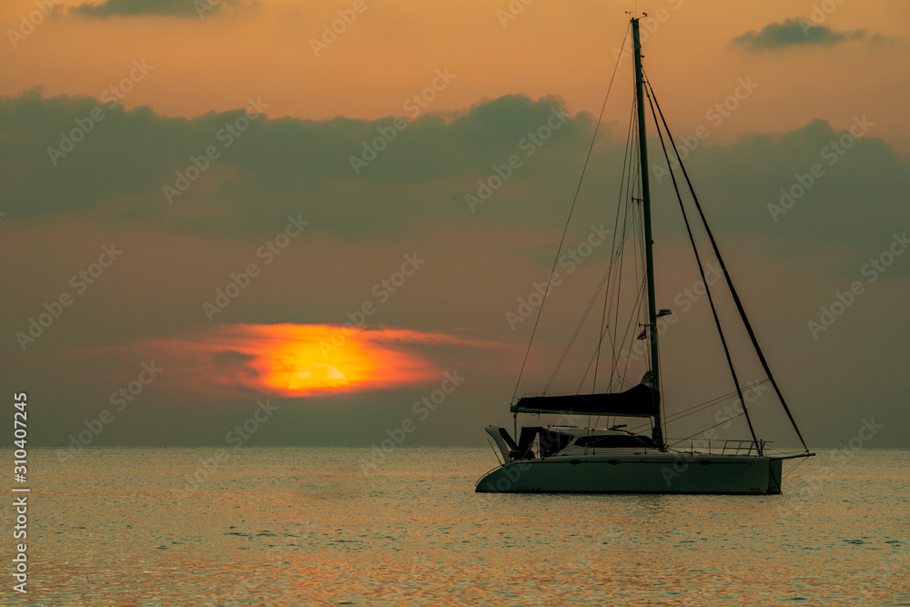 Beautiful boat on Kata beach in Thailand on Phuket. Beautiful sunset.