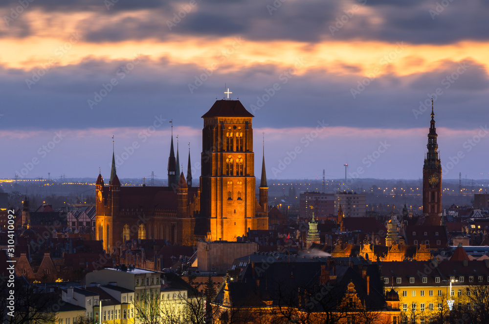 Beautiful cityscape of Gdansk with St. Mary Basilica and City Hall at dawn, Poland.