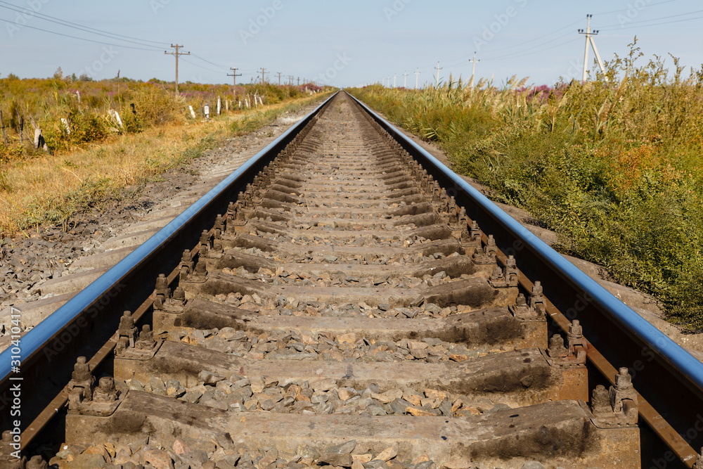 single-track railway line, rails and sleepers, railway track in Kazakhstan