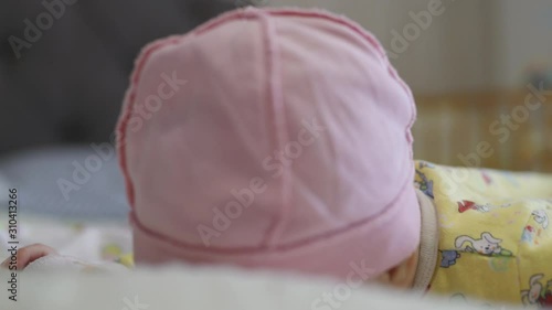 Wallpaper Mural little girl is learning to hold her head Torontodigital.ca