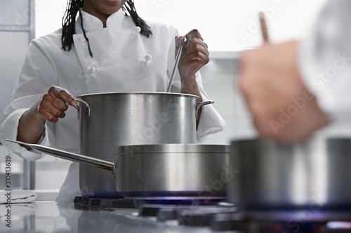 Chefs Cooking In Kitchen