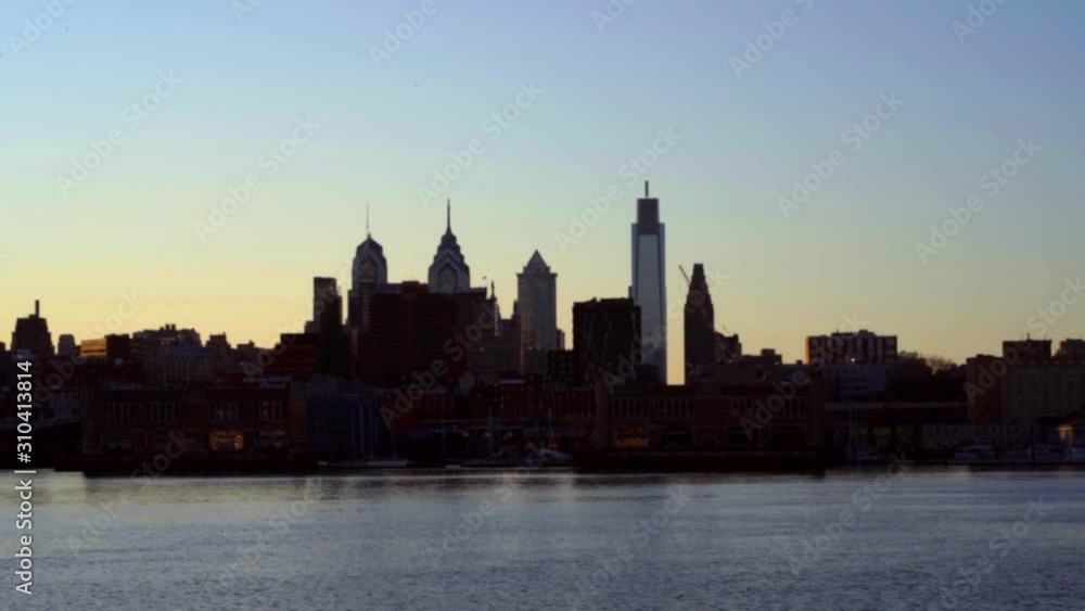 Philadelphia PA skyline time lapse With Different Buildings and Calm river During Sunset - Wide Shot Philadelphia PA skyline time lapse With Different Buildings and Calm river During Sunset - Wide Shot