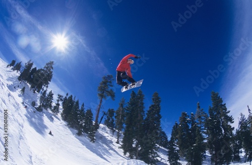 Person On Snowboard Jumping Midair