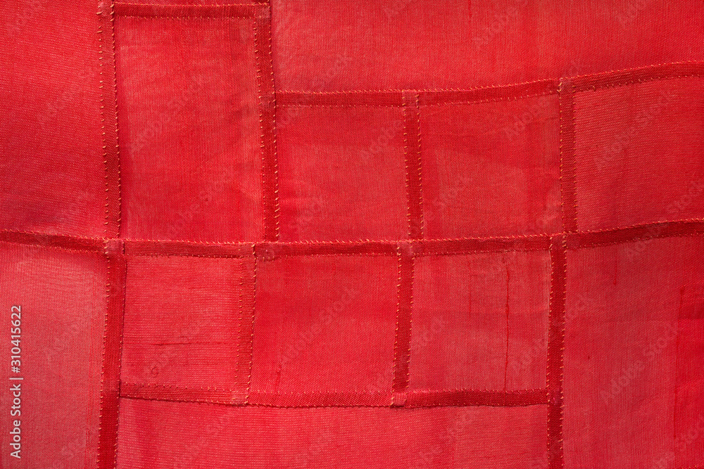 Fototapeta premium Red fabrics with red thread stitching.