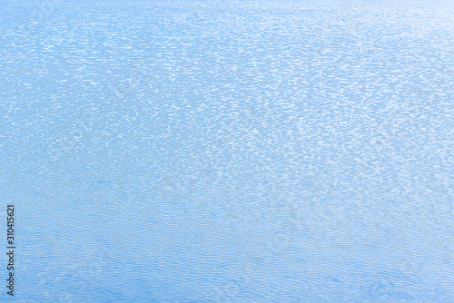 blue water, small waves on the lake background