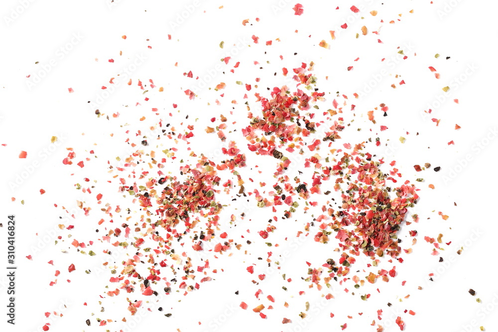 Colorful ground mixed pepper grains, flakes isolated on white background, top view Colorful ground mixed pepper grains, flakes isolated on white background, top view