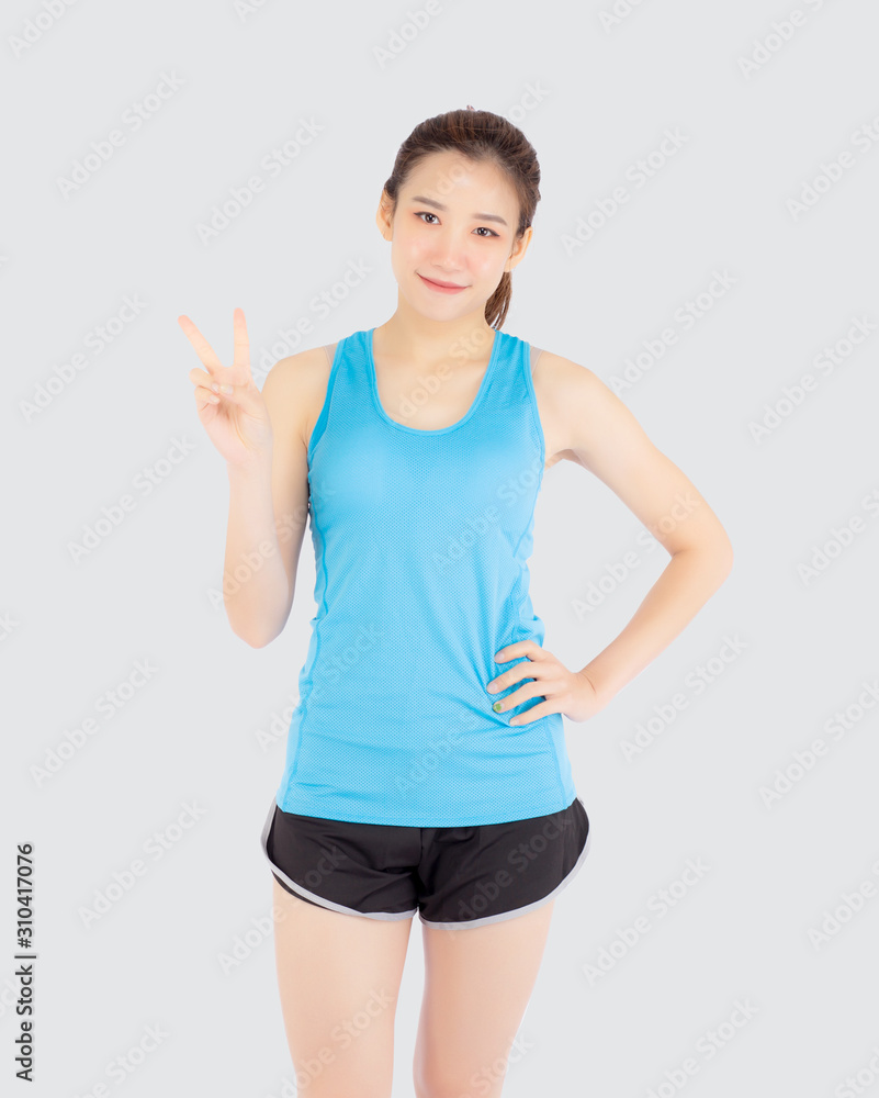 Beautiful portrait young asian woman in sport clothes with satisfied and  confident gesture finger v sign isolated on white background, asia girl  have shape and wellness, exercise for fit with health. Stock