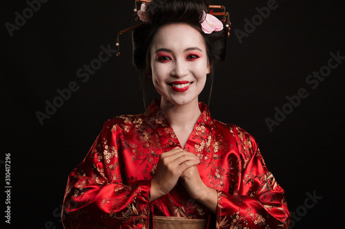 Image of happy geisha woman in traditional japanese kimono smiling
