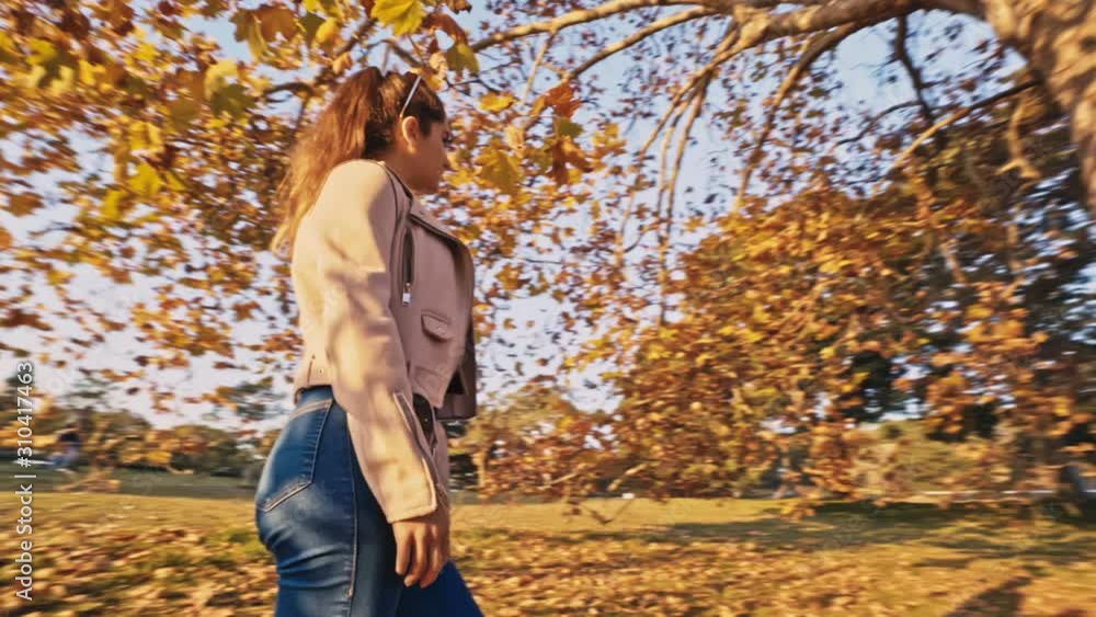 Beautiful young girl stand underneath an Autumn tree, Heroine shot, Centennial Park Sydney Beautiful young girl stand underneath an Autumn tree, Heroine shot, Centennial Park Sydney