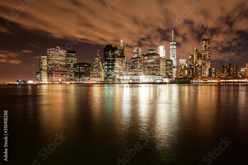 New York night lights, Manhattan from Brooklyn side with reflections on water