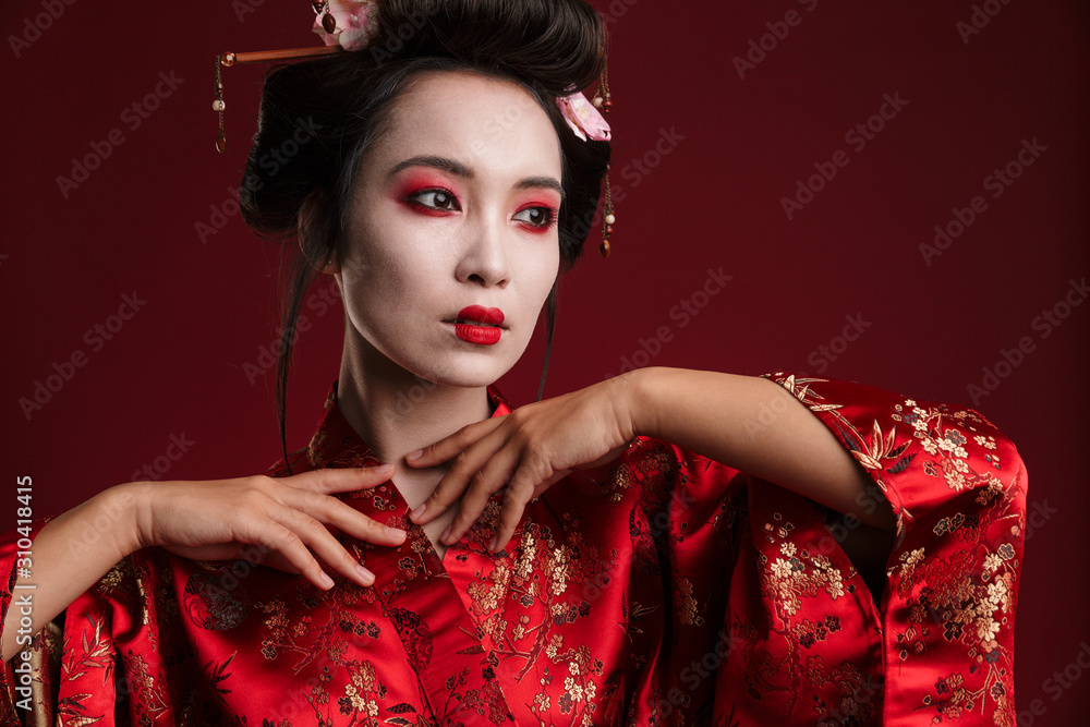 Image of attractive asian geisha woman in traditional japanese kimono Image of attractive asian geisha woman in traditional japanese kimono