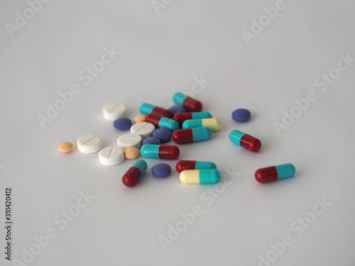 Tablets pills capsule heap mix therapy drugs, colorful