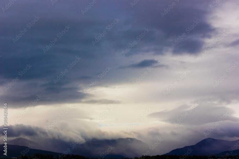 Striking view of heavy precipitation over the Snowdonia Mountain range