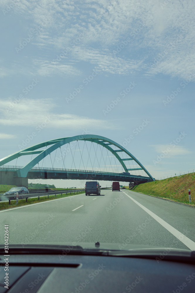 Fototapeta premium Car view over the steel bridge