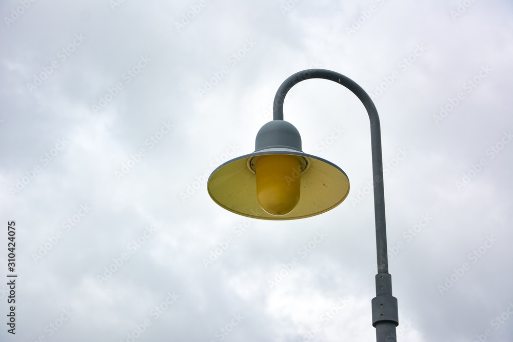 lamp post,Decorative street lamp-post,Retro street lamp shining at night against cloudy sky,Round lamp on pole, outdoor lighting on clear blue sky,street lamp. lamp post,Decorative street lamp-post,Retro street lamp shining at night against cloudy sky,Round lamp on pole, outdoor lighting on clear blue sky,street lamp.