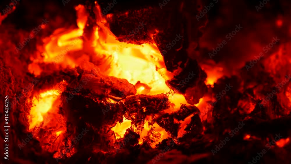 Red hot embers smoldering in the heat of bonfire. UHD Red hot embers smoldering in the heat of bonfire. UHD