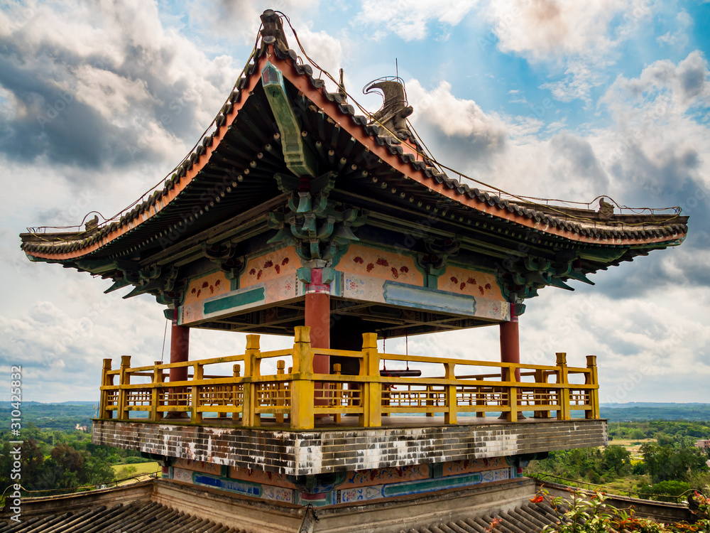 A traditional Chinese roofed pavilion / pagoda on a high mountain in Hainan, China A traditional Chinese roofed pavilion / pagoda on a high mountain in Hainan, China