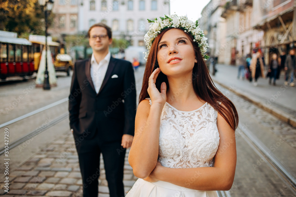 Newlyweds on a wedding day. A walk in the city